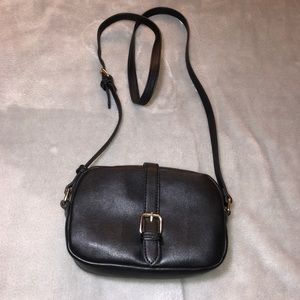Small black purse with gold detailing